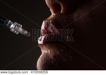 Lips Augmentation. Syringe Female Mouth. Hyaluronic Acid Injection. Age Changes. Cosmetology Treatme