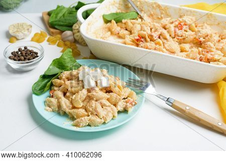Trend Oven-baked Feta Cheese With Tomatoes And Pasta, Pepper Garlic On A Light Background Top View,