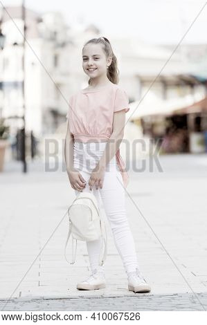 Kid Long Hair Enjoy Walk Sunny Day. Summer Holidays. Charming Stylish Fashionable Girl. Little Child