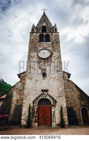 Exterior View Of The Eglise Du Cloitre, Ancient Medieval Gothic Church Near The Castle Of Aigle, Sma