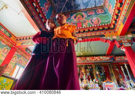Rinchenpong, Sikkim, India - 17th October 2016 : Two Young Boy Lamas Watching Photographer Inside Pr