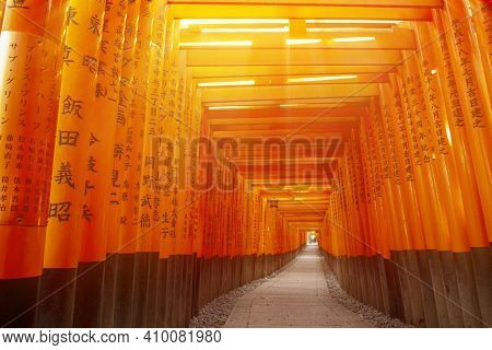 Red Wooden Tori Gate At Fushimi Inari Shrine In Kyoto, Japan