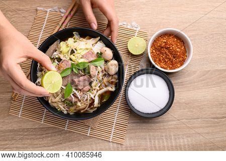 Rice Noodle Soup With Pork, Pork Ball And Vegetables In A Bowl Eating With Lime, Thai Noodles Soup