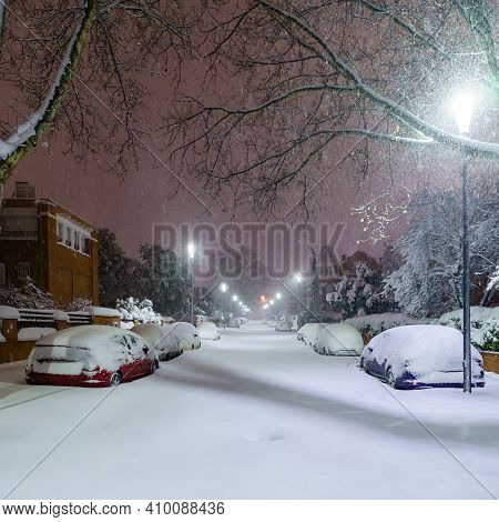 Cars And Streets Covered In Snow In Night Image Of Filomena Storm Fall In Madrid Spain. Europe
