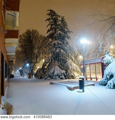 Cars And Streets Covered In Snow In Night Image Of Filomena Storm Fall In Madrid Spain. Winter