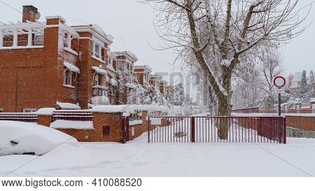 Streets And Buildings Covered In Snow By Day Due To Snowstorm Filomena Falling In Madrid Spain. Euro