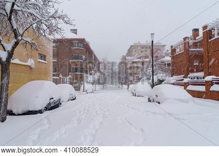 Streets And Buildings Covered In Snow By Day Due To Snowstorm Filomena Falling In Madrid Spain. Euro