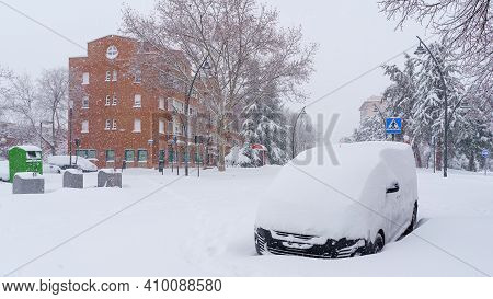 Streets And Buildings Covered In Snow By Day Due To Snowstorm Filomena Falling In Madrid Spain. Euro