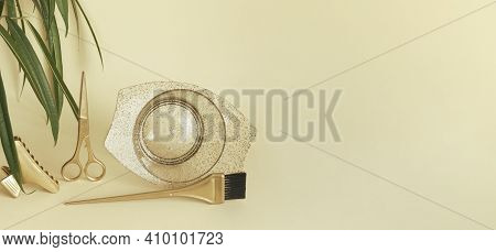 Banner With Gold Hairdressing Tools, Plant Leaves On A Yellow Background. Scissors, Clip, Brush And 