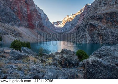 Mountain Landscape With Lake In The Early Morning. Tajikistan Fann Mountains. View On Greater Allo L