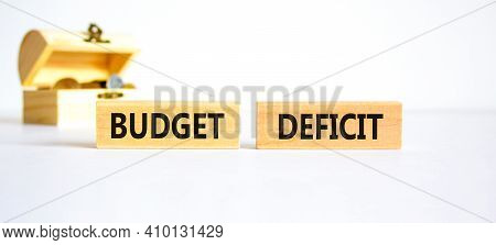 Budget Deficit Symbol. Concept Words 'budget Deficit' On Wooden Blocks On A Beautiful White Backgrou