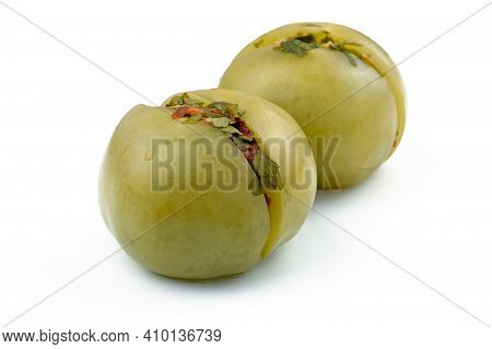 Stuffed Green Tomatoes On A White Plate. Pickled Pickled Tomatoes Stuffed With Spices And Finely Cho