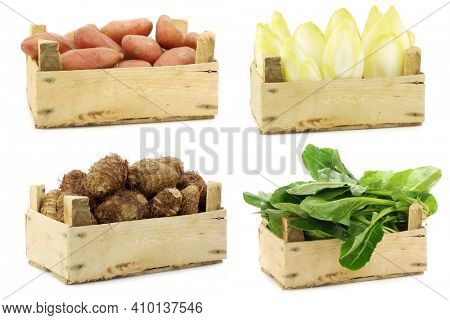 Fresh cooking vegetables in a wooden crate on a white background