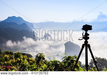 Foggy Landscape View On Mountain Agints Sky