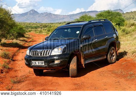 Taita Hills, Kenya - February 3, 2021: Offroad Car Toyota Land Cruiser Prado 120 At The Gravel Road.