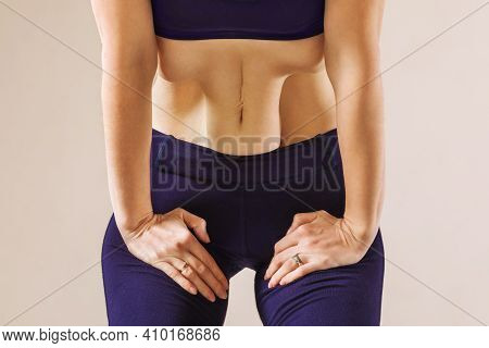 A Woman Practicing Hatha Yoga, Performs The Exercise Nauli (wavy Movement Of The Abdominal Muscles),