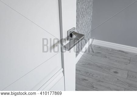 Modern Metal Door Handle On White Wooden Door In Interior. Knob Close-up Elements. Door Handle, Fitt