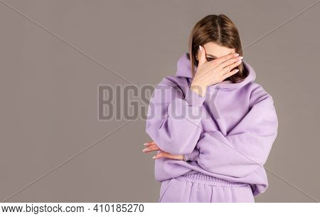 Portrait Of Annoyed Stylish European Girl Showing, Making Face Palm Gesture, Feeling Bored While Tal