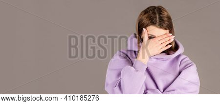 Portrait Of Annoyed Stylish European Girl Showing, Making Face Palm Gesture, Feeling Bored While Tal