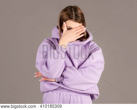 Portrait Of Annoyed Stylish European Girl Showing, Making Face Palm Gesture, Feeling Bored While Tal