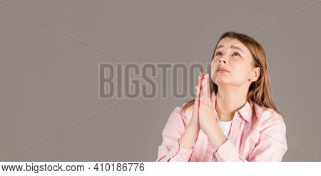 Gloomy Dissatisfied Woman Keeps Palms In Prayer Gesture, Feels Sorry For Making Mistake, Asks For Fo