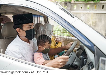 Muslim Family Wearing Face Mask During Travel By Car
