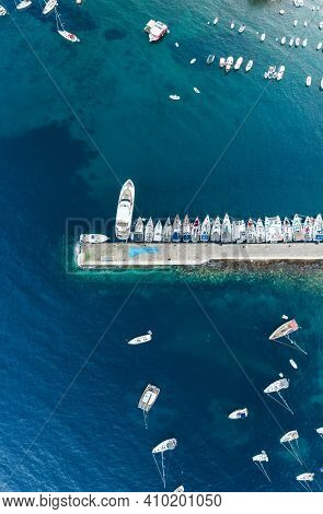 Komiza, Croatia - Aug 19, 2020: Aerial Overhead Shot Of Komiza Town Port Of Vis Island Before Sunris