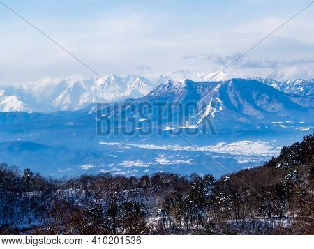 The Snow-covered Peaks Of The Japanese Alps As Viewed From Near The Summit Of The Shiga Kogen Ski Ar