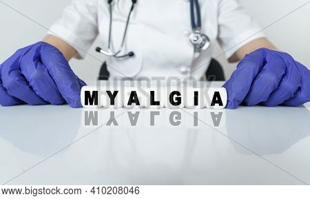 Medicine And Health Concept. The Doctor Put Together A Word From Cubes Myalgia