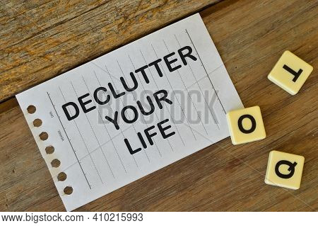 Alphabet Letters And White Paper Written With Declutter Your Life.