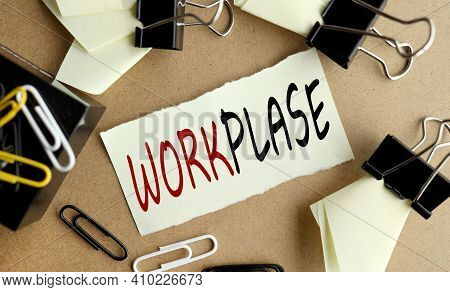 Workplase. Business Concept. Text On Yellow Sticker On Chalkboard Near Stationery