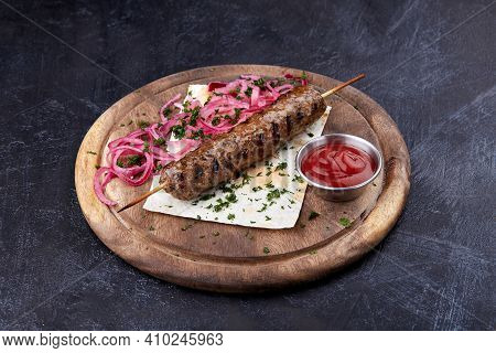 Lula Kebab With A Red Onion And Salade, Traditional Caucasian Dish.