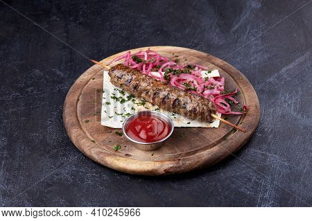 Lula Kebab With A Red Onion And Salade, Traditional Caucasian Dish.