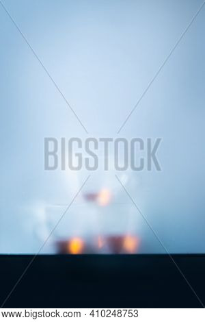 Glass Teacups Pyramid Behind A Matte Glass, Cold Morning Atmosphere