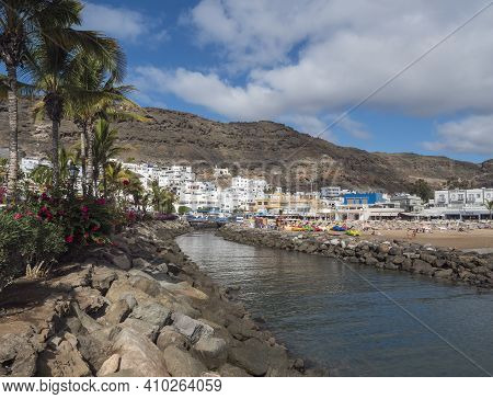 Puerto De Mogan, Gran Canaria, Canary Islands, Spain December 18, 2020: View On The Public Beach Wit