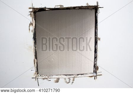 A Sawed Hole In A Bank Safe. Sentry Safe Cut Hole. Explosion-proof Steel Walls Of The Safe Filled Wi