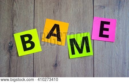 Bame Symbol. Abbreviation Bame, Black, Asian And Minority Ethnic On Colored Papers. Beautiful Wooden