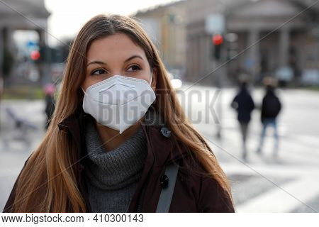 Sense Of Bewilderment. Close Up Of Young Woman In Winter Clothes Walking In Street Wearing Protectiv