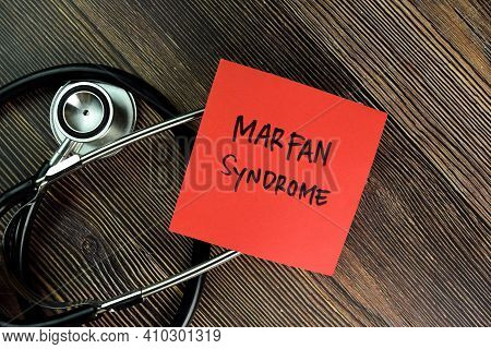 Marfan Syndrome Write On Sticky Notes Isolated On Wooden Table.
