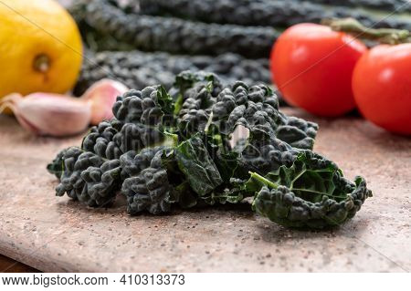 Cooking With Black Flat Leaves Of Cavolo Nero Tuscan Cabbage