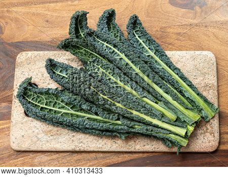 Cooking With Black Flat Leaves Of Cavolo Nero Tuscan Cabbage