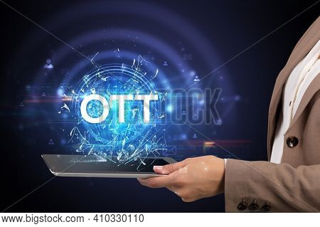 Close-up of a touchscreen with OTT abbreviation, modern technology concept