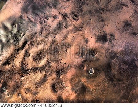 Metal Bronze Textured Plate. Bronze Or Copper Polished Surface With Dents, Scratches And Indentation