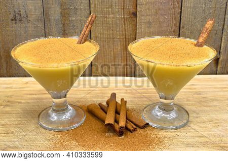 Boza And Cinnamon Sticks, Traditional Turkish Cuisine Drinks, On Wooden Bamboo Background