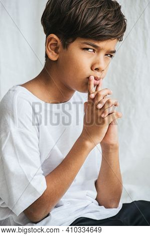 Indian Asian Kid Looking At You With Suspition, Evaluating You