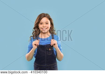 Shes Got A Pretty Smile. Little Girl With Cute Smile On Blue Background. Smiling Kid With White Heal