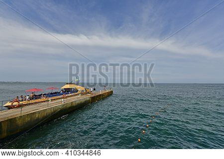 Ukraine, Odessa 07/27/2020. Lanzheron Beach. A Picturesque Embankment With Palm Trees, Fountains, Ge