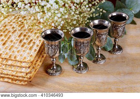 Wine With Kosher Four Glasses Of Matzah A Passover Haggadah On A Vintage Wood Background