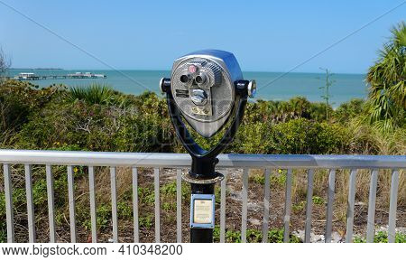 St Petersburg, Florida, U.s - February 16, 2021 - A Public Binocular Near Fort Desoto Park