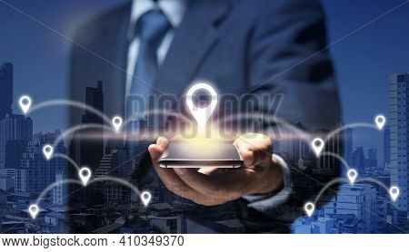 Businessman Use Internet Network On Mobile Phone Find Location In The City By Gps Navigator Map. Man